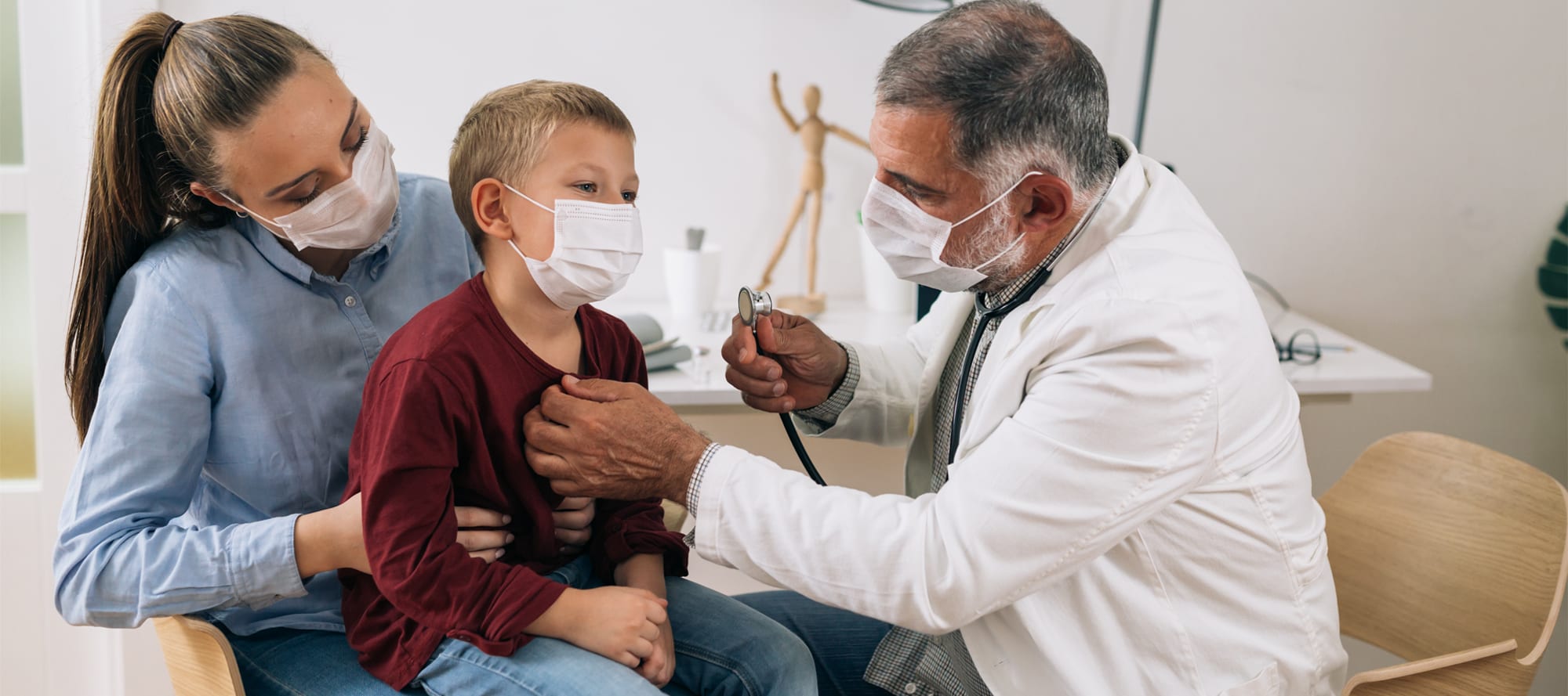 Doctor evaluating health of child