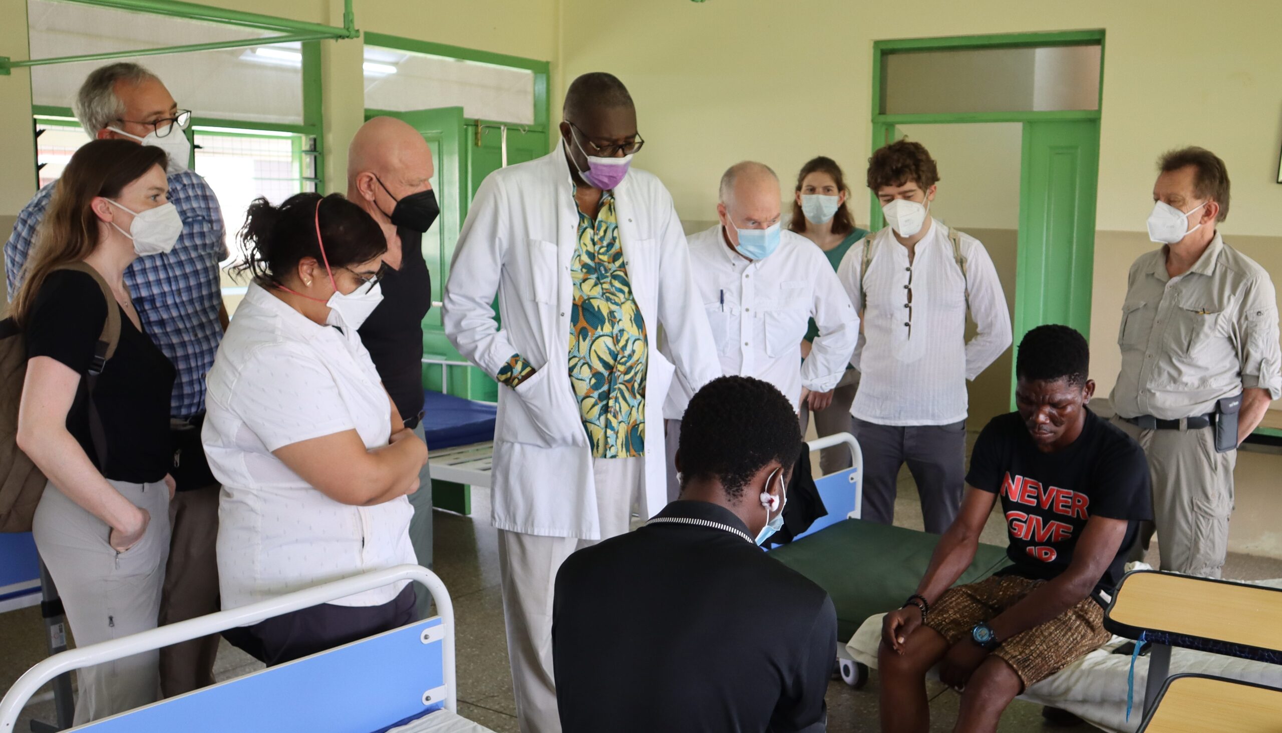 Dr. Otabir, Dr. Schaefer, Dr. Griffin (Parasites Without Borders co-founder and president) & other TROPMEDEX participants on the Leprosy Ward at Ankaful Hospital in Ghana (February 2022)