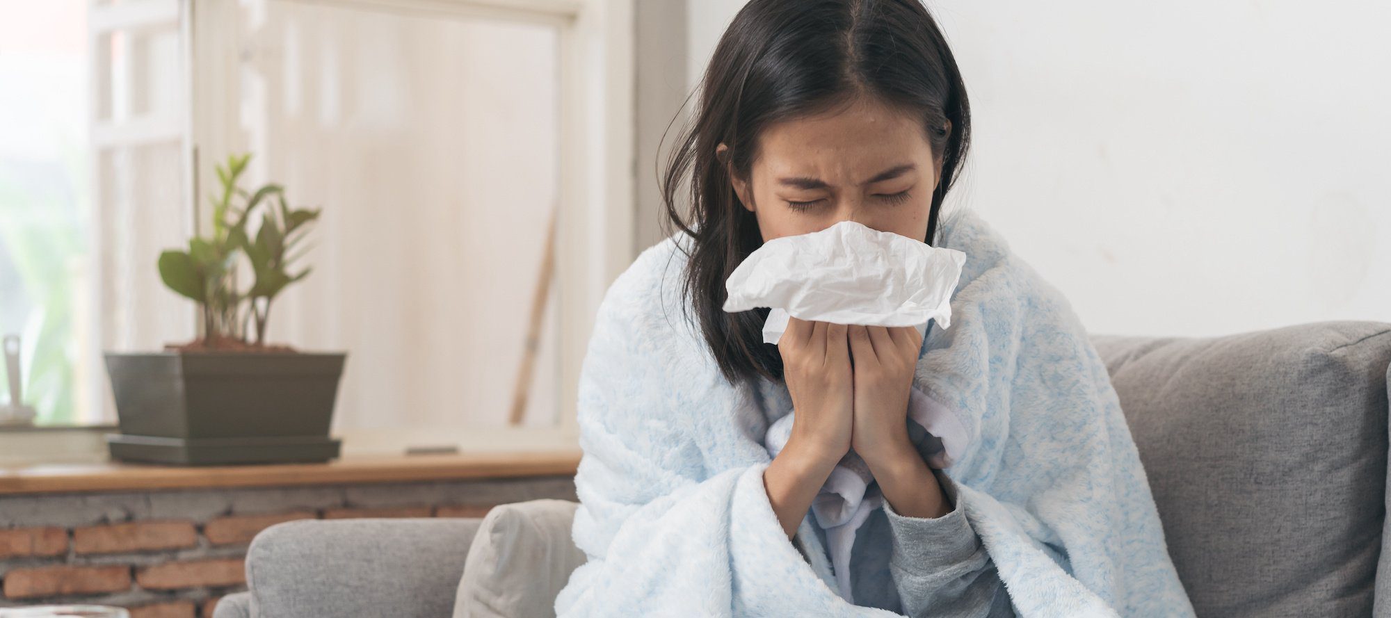Asian woman has runny and common cold.