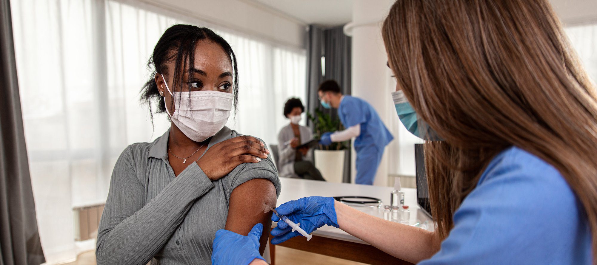woman getting a vaccine