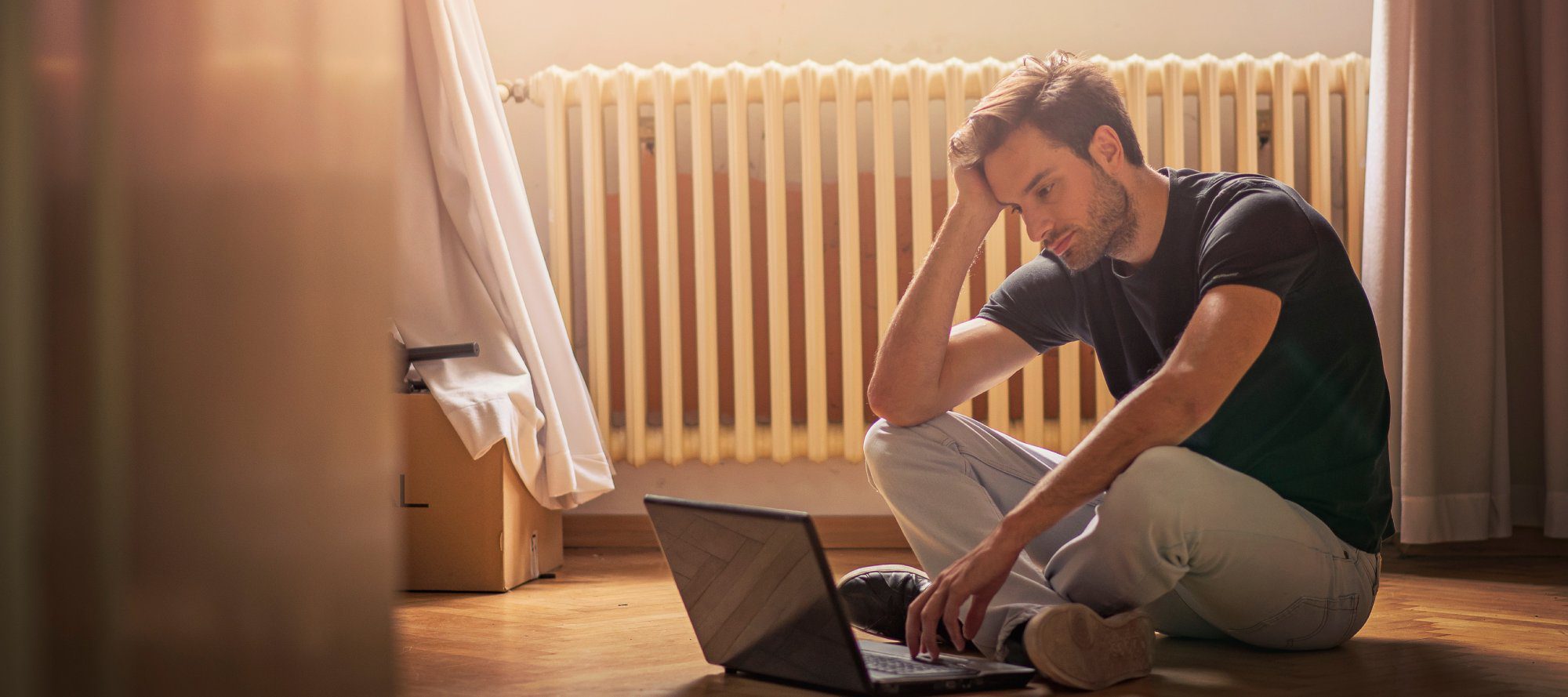 Teenager working on laptop and feeling depressed