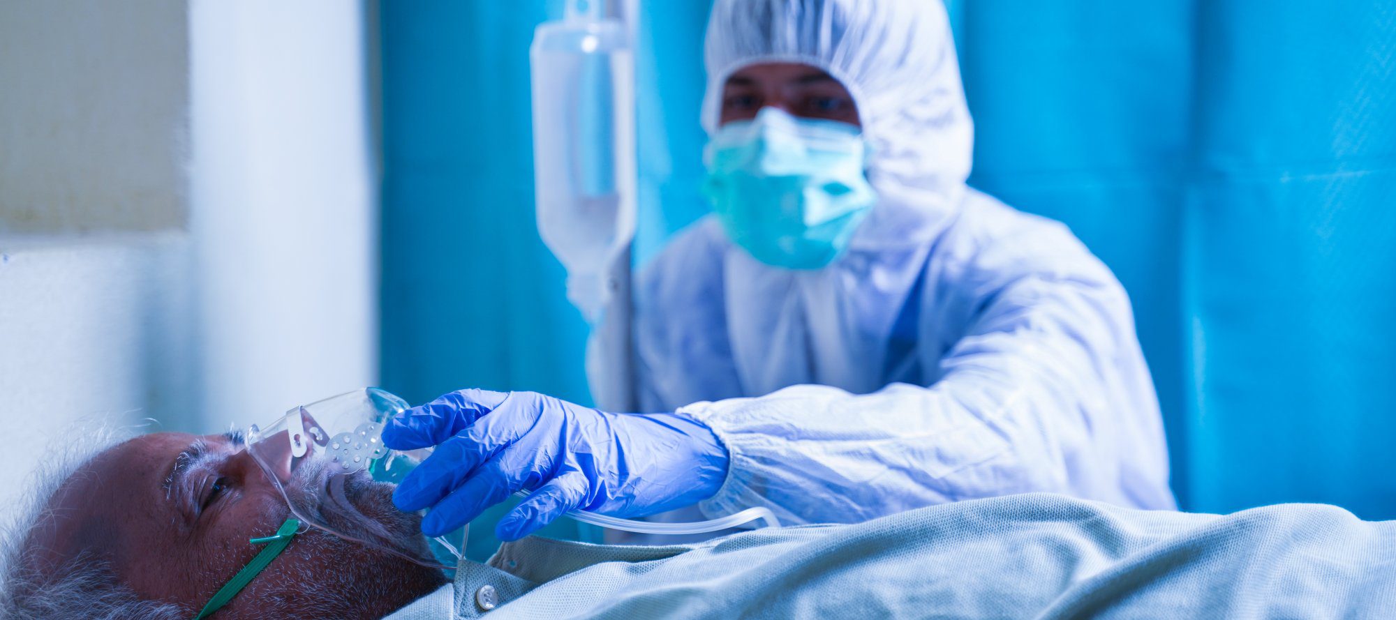 healthcare worker giving oxygen to a patient