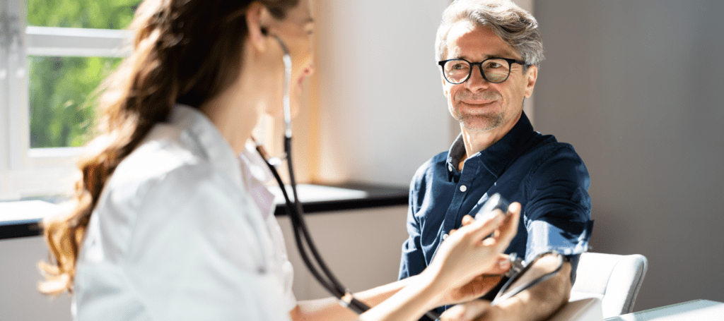 Middle-aged man getting blood pressure taken