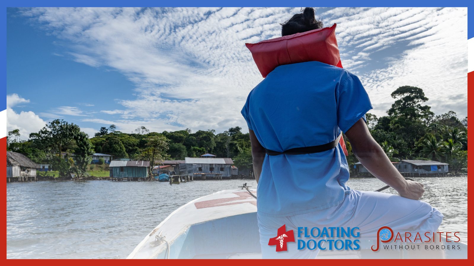 Floating Doctors Fundraiser — a doctor sitting on a boat with back towards camera