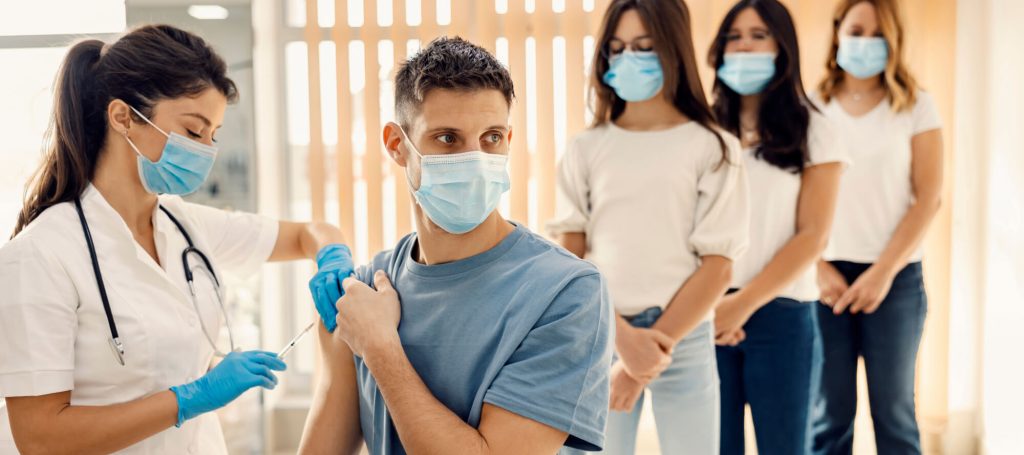 Person receiving a COVID-19 vaccine injection