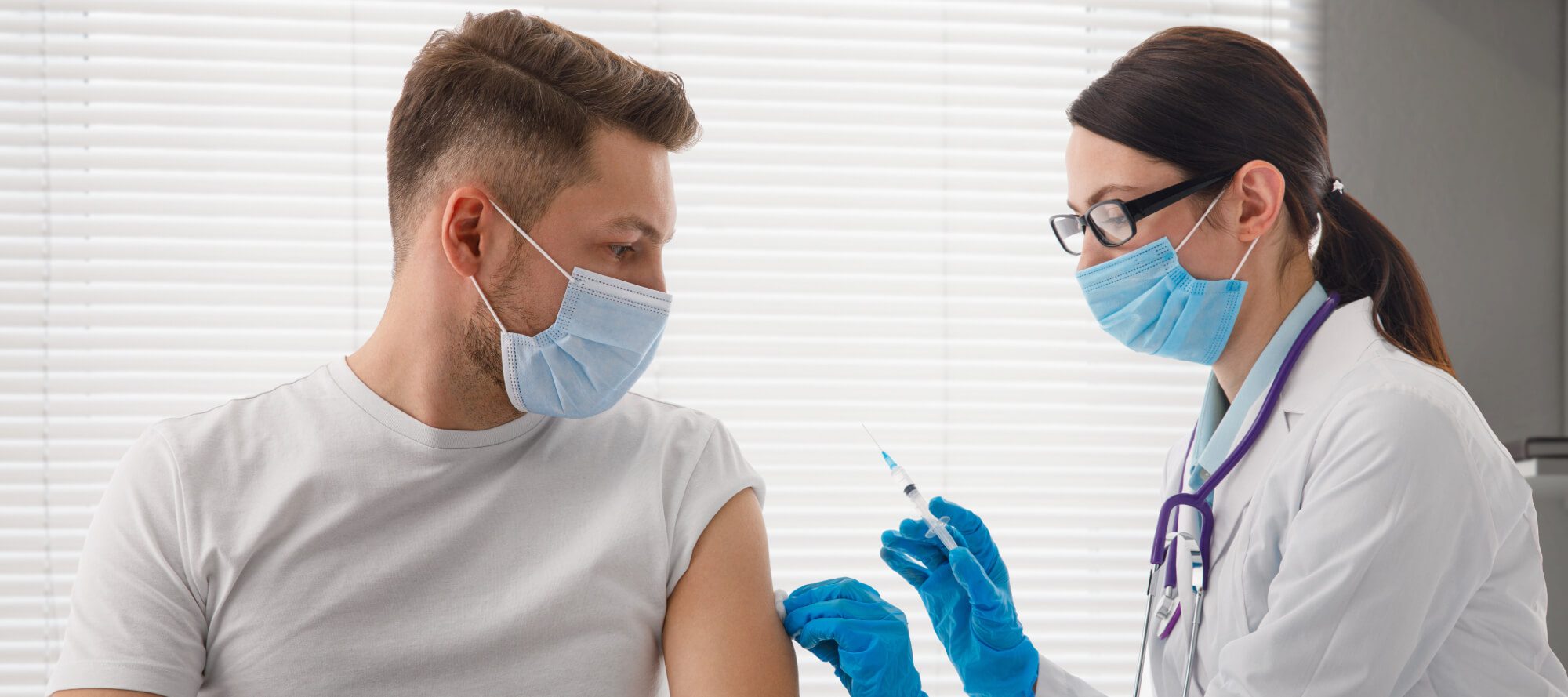 Close-up of a young person getting a COVID vaccine injection