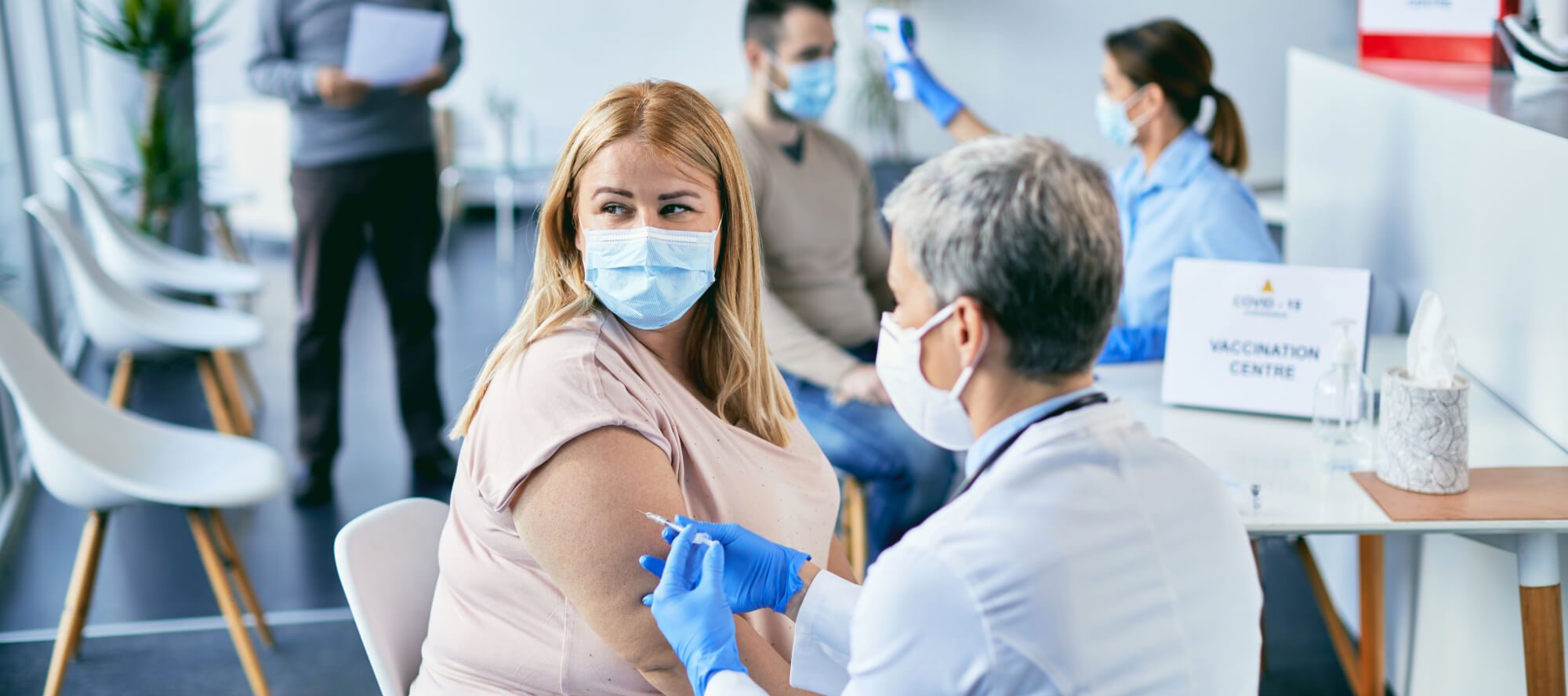 A woman receiving a COVID-19 vaccine injection