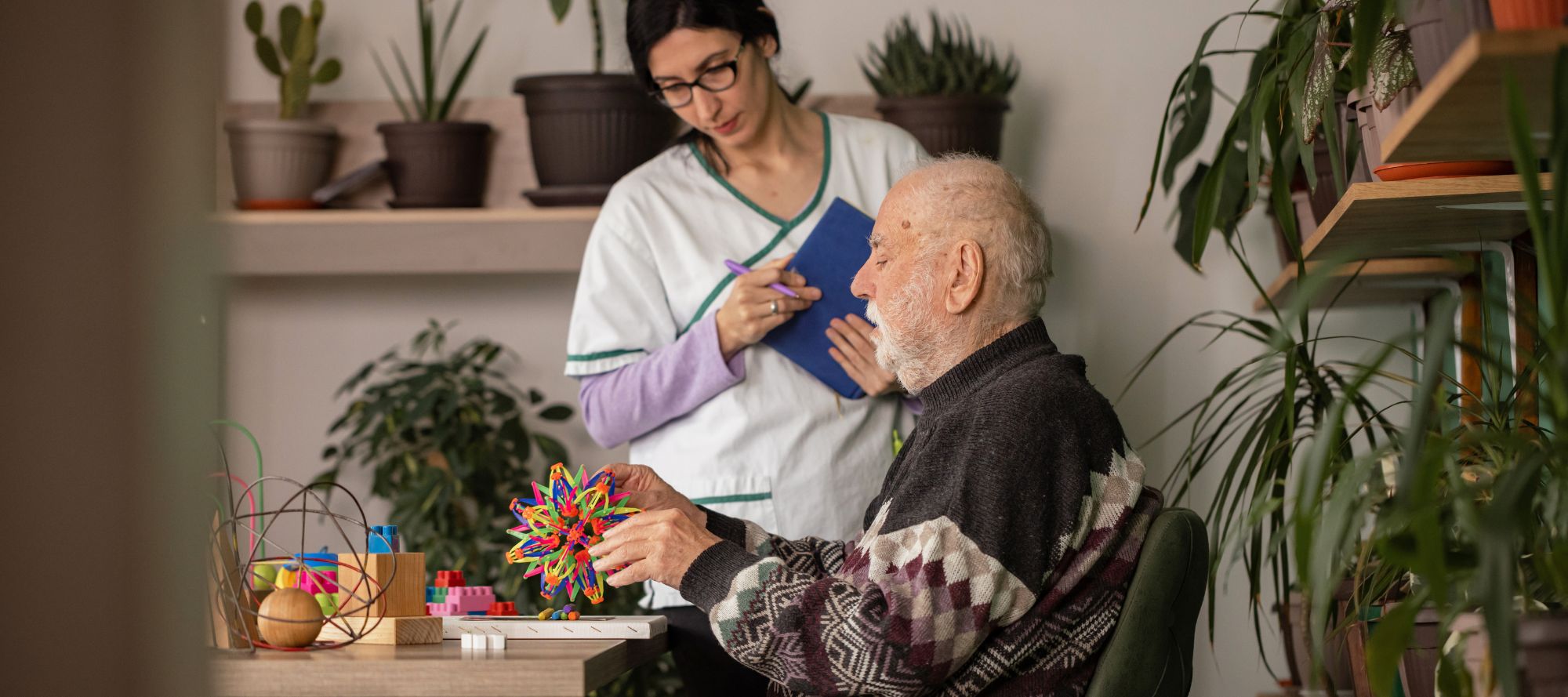 Caretaker looking over dementia patient
